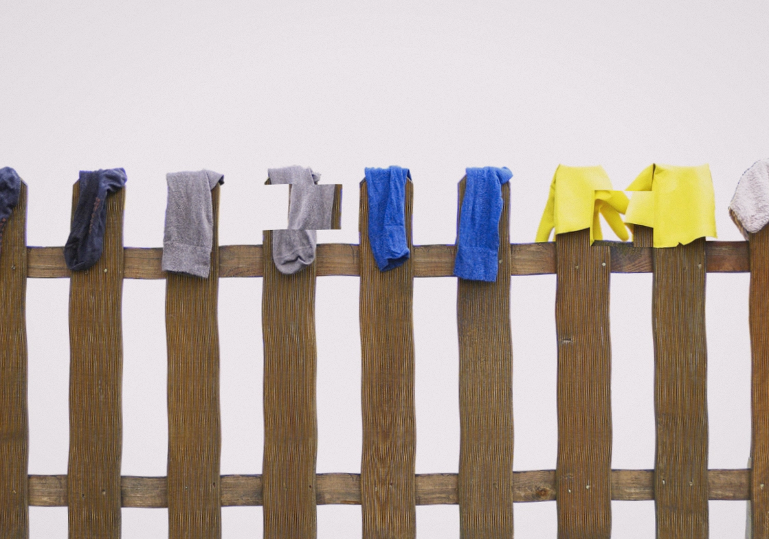 Close-up of a Blemaro finisher steaming a silk dress